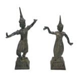 A pair of Thai white metal figures, modelled as a dancing man and woman, in traditional outfits,