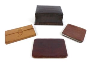 A collection of vintage leather goods, comprising an Asprey of London leather gaming wallet; two