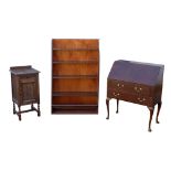 A group of furniture, comprising a freestanding bookshelf, a mid 20th century bureau, and a small