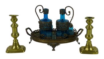 A Continental blue glass and cast metal liqueur set, tray, two decanters, and six cups, 21cm high
