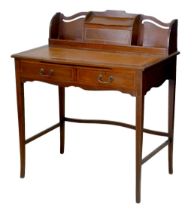 An Edwardian mahogany ladies writing desk, shaped upstand with letter rack, leather skivver, two