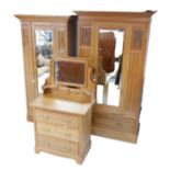 An Edwardian satin walnut bedroom suite, two single wardrobes, and dressing chest. (3)