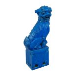 A Chinese porcelain turquoise glazed figure of a Buddhistic lion dog, circa 1960, modelled seated