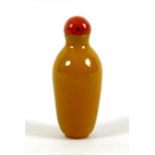 A 19th century Chinese snuff bottle, mustard yellow coloured stone, or possibly Peking glass,