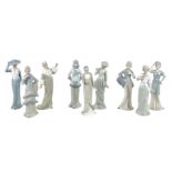 A group of nine china figurines, 'The Golden Age of Fashion', issued by Iris Publishing Ltd.,