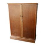A 1950s 'Compactum' oak wardrobe, with fold out doors opening to reveal a fully fitted interior, and