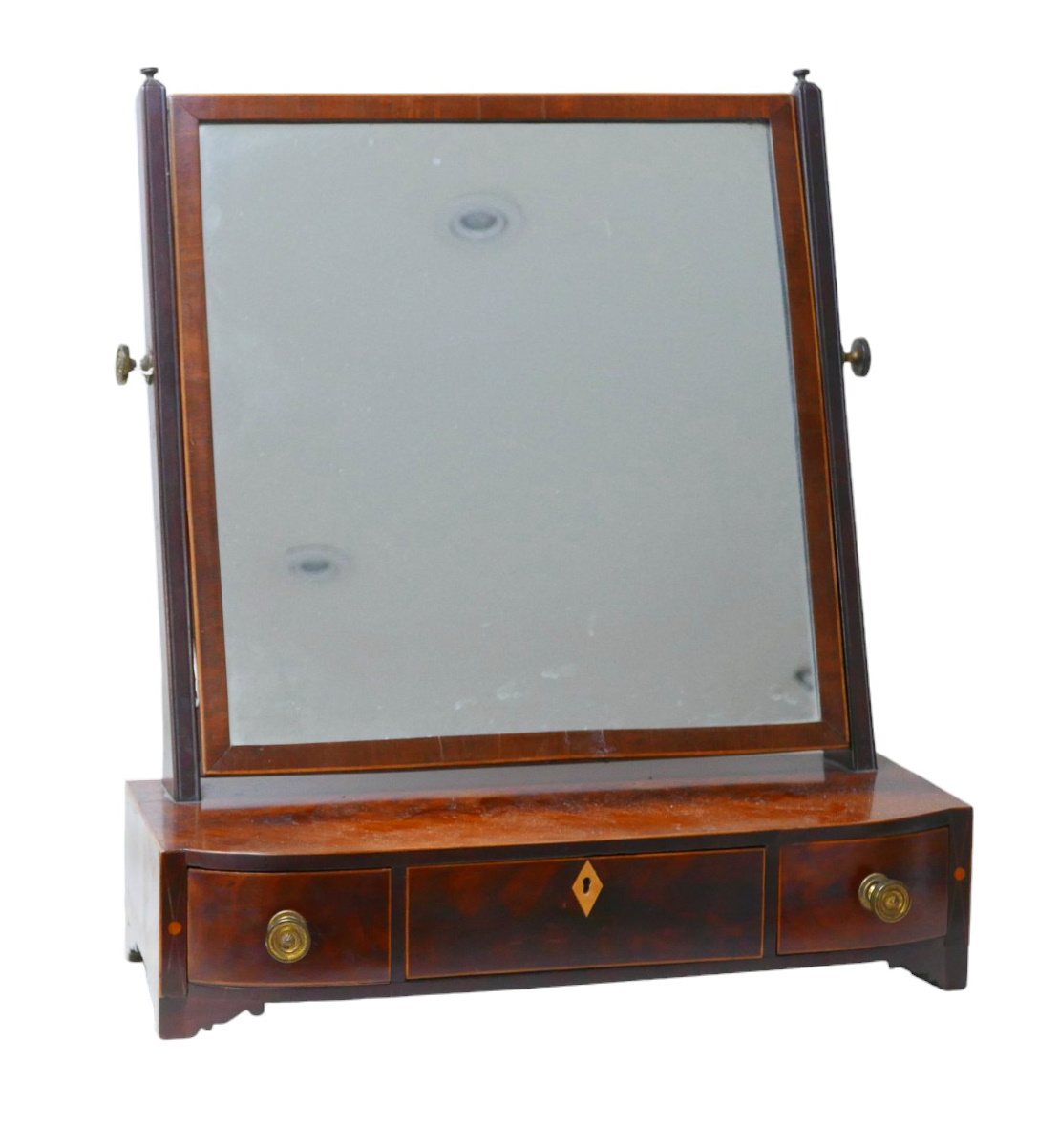 A Regency mahogany toilet mirror, raised upon bracket feet, 55 by 31 by 62cm high. Repair to feet.