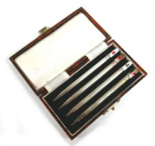 A boxed set of silver bridge pencils.