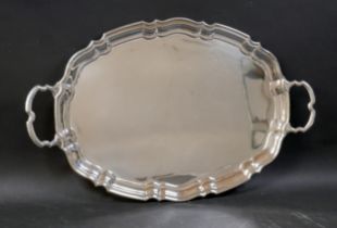An Elizabeth II silver twin handled tray, with shaped outline, Emile Viner, Sheffield 1956, 56 by 35