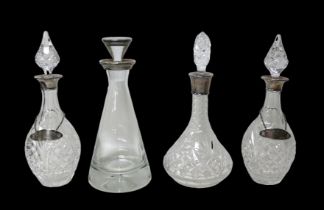 Four ERII silver mounted spirit decanters, together with two ERII silver spirit labels, S J Rose &