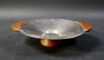 An Elizabeth II silver dish, of circular form fitted with twin wooden handles and wooden pedestal