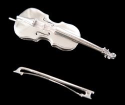 A miniature silver cello, with individual silver wire strings, 10.5cm long, a bow, also with two