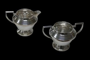 Two pieces of George VI silver tea wares, comprising a milk jug, 13 by 9.5 by 9.5cm high, and a twin