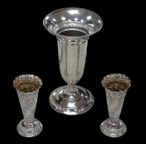 Three Victorian and later silver vases, comprising a George V trumpet form vase, with inscription '