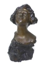 Giuseppe Renda (Italian, 1859-1939): a bronze head and shoulder bust of a lady, signed 'Renda' in