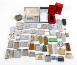 An interesting collection of petrol and gas lighters, including a Dunhill lighter. (1 bag)