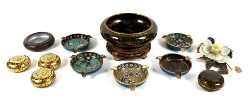 A modern Chinese cloisonne enamel bowl, 20.5 by 7cm high, on a carved wooden stand.