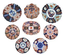 A collection of seven Japanese Imari dishes and plates, together with a 19th century English Imari