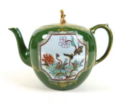 An early 19th century Ironstone teapot, with green ground and two panels of flowers, Canton pattern,