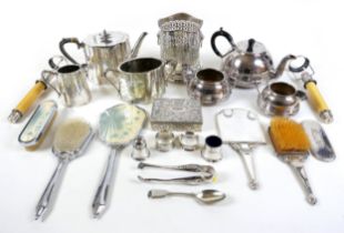 A group of silver plated wares, including two tea sets, two brush and mirror sets, a lidded box,