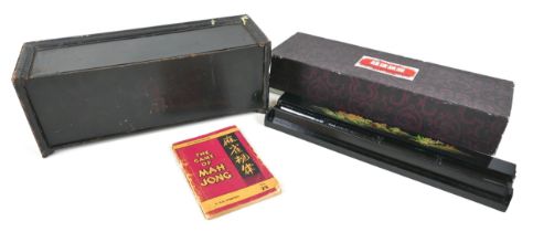 A 20th century Mahjong set, the ebonised case with removable front panel revealing four trays,