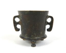 A Chinese bronze twin handled censer with foundry mark, 7cm wide by 5cm tall