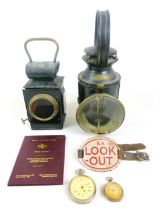 A group of railway memorabilia, including two oil lamps, a British Rail 'Look Out' arm band, British