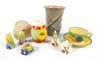 A collection of Clarice Cliff, including a Daffodil shaped preserve pot in the pattern 'Nasturtium',