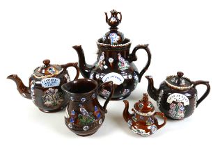 A group of bargeware teapots and jug, the largest teapot 36cm high, the jug, a/f, 15.5cm high and