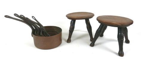 A pair for small four legged stools, with circular tops and turned legs, each 25.5 by 18 by 16.5cm