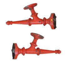 Two Victorian cast iron wall sconces, originally from St. Pancras Station, London, painted red, each