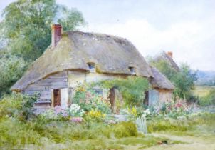 Henry John Sylvester Stannard (British, 1870-1951): a thatched cottage