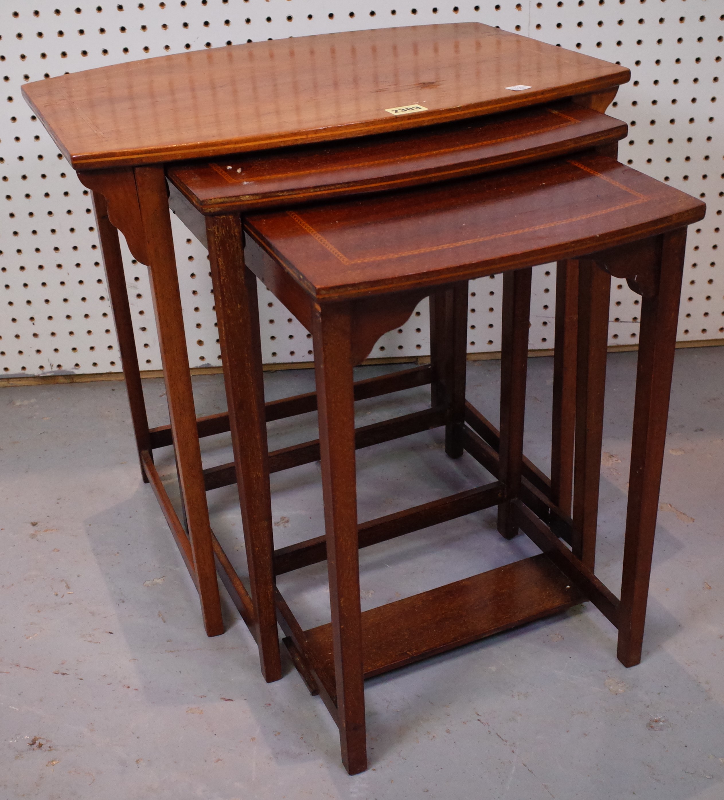 A NEST OF THREE INLAID MAHOGANY OCCASIONAL TABLES (3