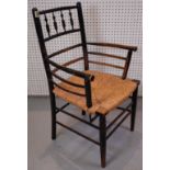 WILLIAM MORRIS, A LATE 19TH CENTURY EBONISED BEECH SUSSEX ARMCHAIR