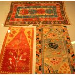 A GROUP OF THREE RUGS (3)