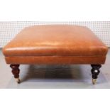A MODERN TAN LEATHER UPHOLSTERED SQUARE FOOTSTOOL