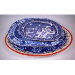 A GROUP OF FOUR LARGE OVAL MEAT PLATES, THREE BLUE AND WHITE AND ONE OTHER