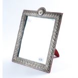 A LATE VICTORIAN SILVER MOUNTED MIRROR