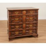 A CHARLES II AND LATER OAK GEOMETRIC MOULDED FOUR DRAWER CHEST