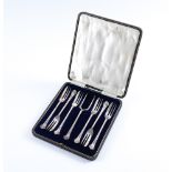 A SET OF SIX SILVER PASTRY FORKS WITH A SERVING FORK