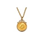 A GEORGE V 1911 HALF SOVEREIGN PENDANT FITTED WITH A NECK CHAIN (2)