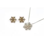 A 9CT GOLD AND DIAMOND SNOWFLAKE PENDANT WITH A 9CT WHITE GOLD NECKCHAIN AND A PAIR OF...