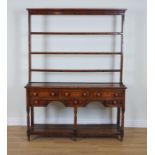 AN 18TH CENTURY OAK OPEN BACK POTBOARD DRESSER