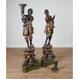 A PAIR OF POLYCHROME PAINTED FIGURES OF MOORS (2)