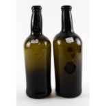 TWO `BLACK GLASS' SEALED WINE BOTTLES (2)