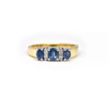 AN 18CT GOLD, SAPPHIRE AND DIAMOND RING