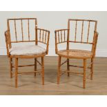 A PAIR OF LATE 19TH CENTURY POLYCHROME PAINTED FAUX BAMBOO OPEN ARMCHAIRS (2)