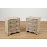 A PAIR OF GREY PAINTED PINE THREE DRAWER BEDSIDE TABLES (2)