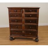 A CHARLES II OAK RAISED MOULDED SIX DRAWER CHEST OF DRAWERS