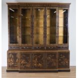 AN EARLY 20TH CENTURY BLACK LACQUER CHINOISERIE DECORATED BREAKFRONT BOOKCASE CABINET